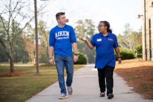 Two students walking outside on campus