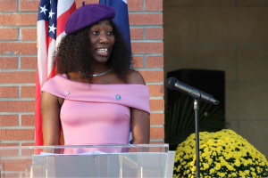 Student standing at podium speaking
